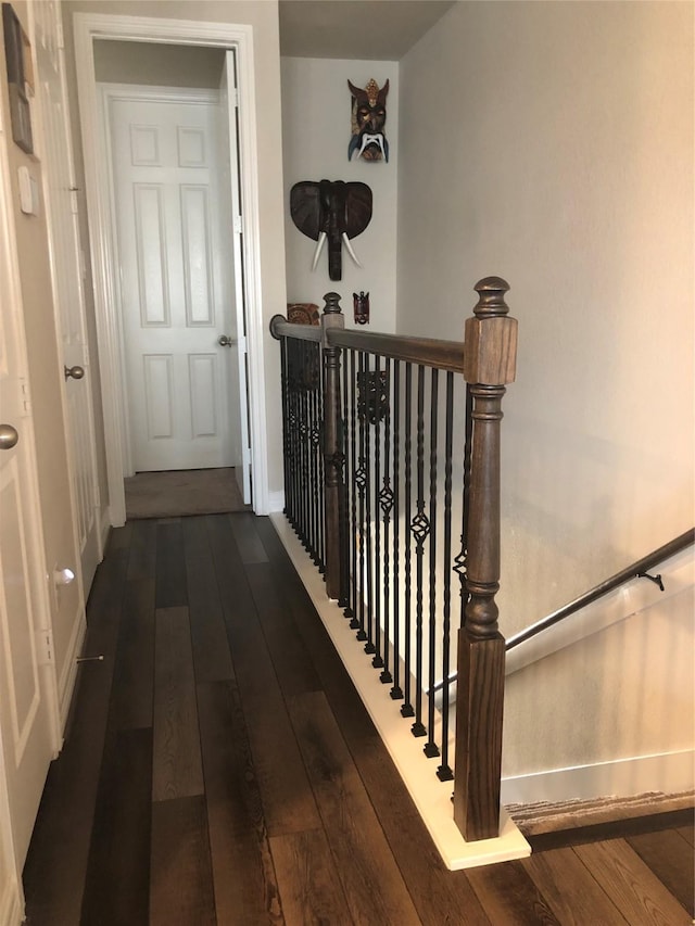 9470 Caddo Ridge Ln, Cypress, TX 77433 - hallway with dark wood-style floors and an upstairs landing