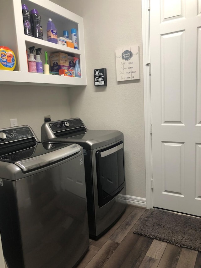 9470 Caddo Ridge Ln, Cypress, TX 77433 - washroom featuring washer and clothes dryer and dark wood-style floors