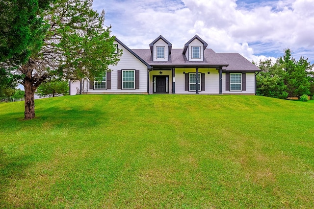 130 Canary Ln, Coldspring, TX 77331 - cape cod house with a front lawn and a porch