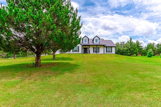130 Canary Ln, Coldspring, TX 77331 - cape cod-style house with a front yard