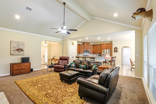 130 Canary Ln, Coldspring, TX 77331 - living room featuring arched walkways, light colored carpet, a ceiling fan, beamed ceiling, and light tile patterned flooring