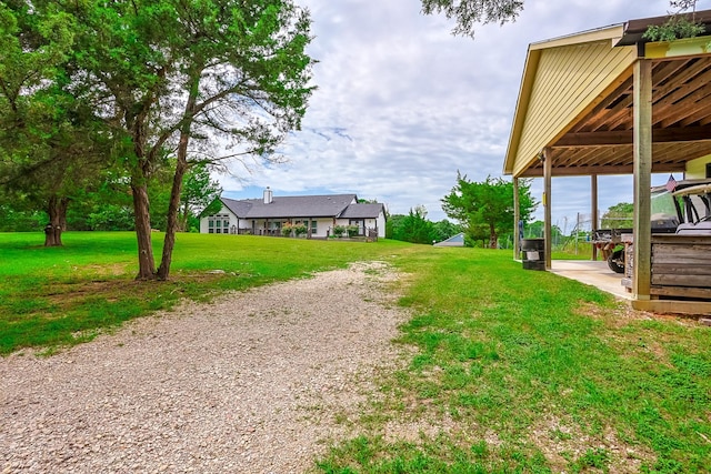 130 Canary Ln, Coldspring, TX 77331 - view of green lawn with a carport