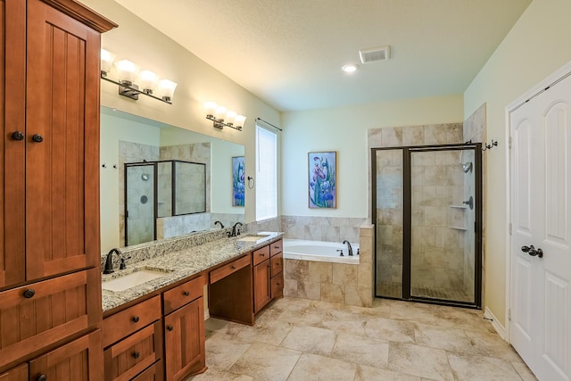 130 Canary Ln, Coldspring, TX 77331 - full bath featuring a bath, a shower stall, and double vanity