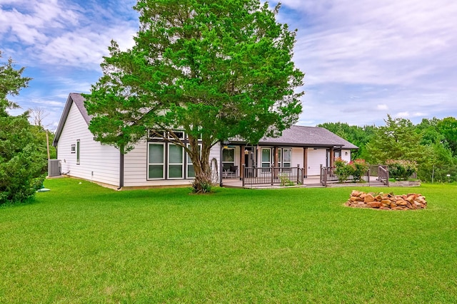 130 Canary Ln, Coldspring, TX 77331 - rear view of house with a yard
