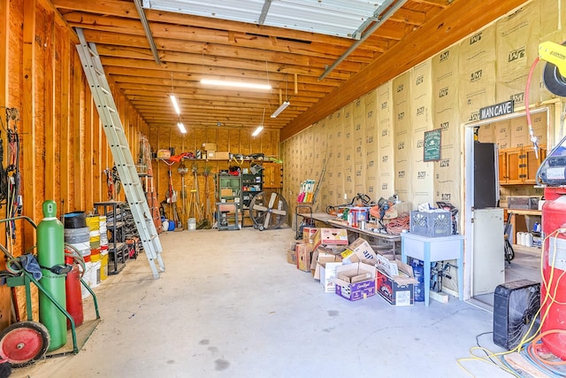 130 Canary Ln, Coldspring, TX 77331 - garage featuring a workshop area