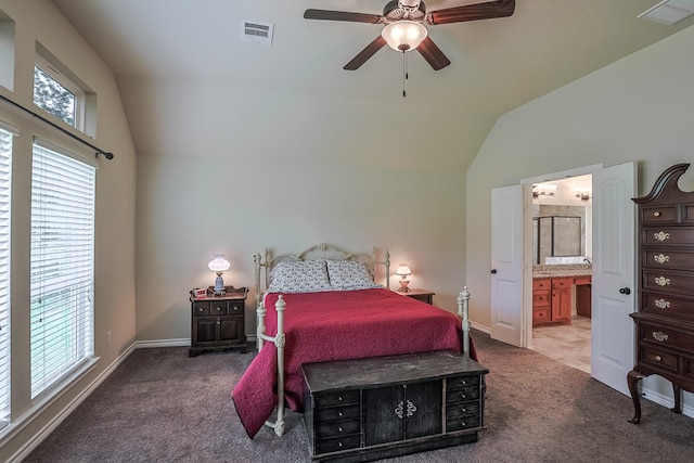 130 Canary Ln, Coldspring, TX 77331 - carpeted bedroom with vaulted ceiling, connected bathroom, and a ceiling fan