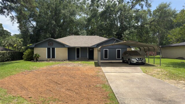 8228 Ponderosa Dr, Silsbee, TX 77656 - ranch-style house with driveway, a front lawn, brick siding, and a detached carport
