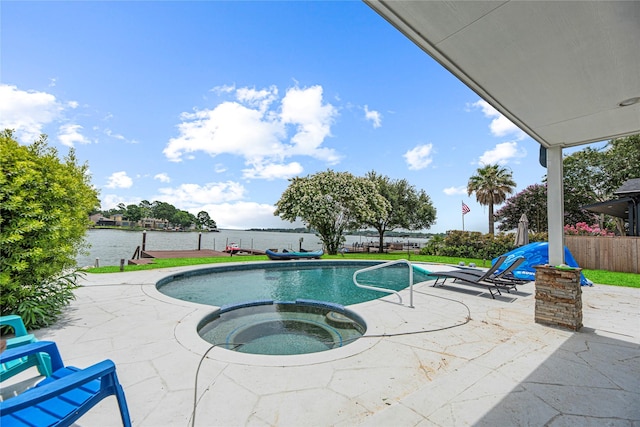 3114 Canterbury Ln, Montgomery, TX 77356 - view of pool with a patio area, a water view, and a pool with connected hot tub