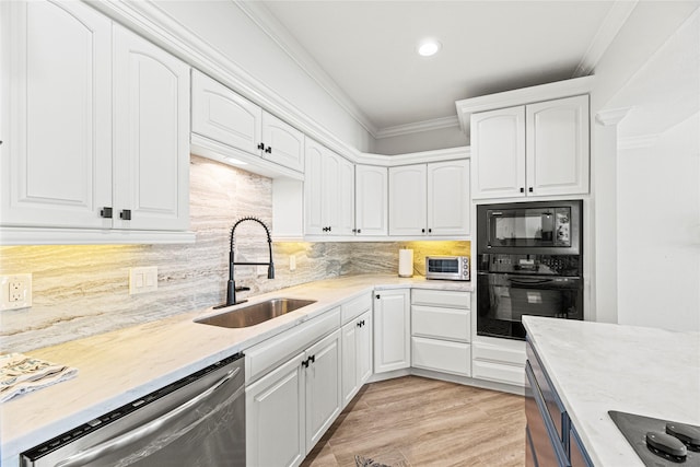 3114 Canterbury Ln, Montgomery, TX 77356 - kitchen featuring black appliances, white cabinetry, ornamental molding, light stone counters, and tasteful backsplash