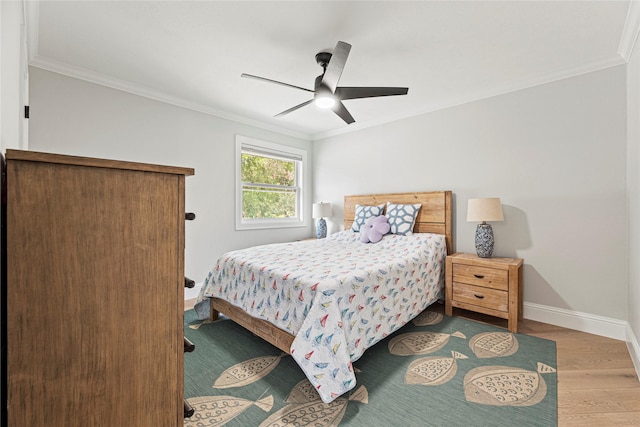 3114 Canterbury Ln, Montgomery, TX 77356 - bedroom with wood finished floors, crown molding, and a ceiling fan