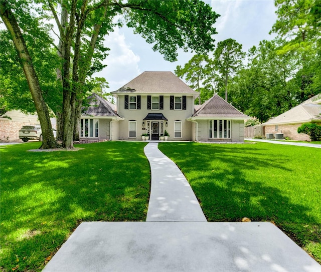 11715 Cypresswood Dr, Houston, TX 77070 - colonial-style house with a front lawn and stucco siding