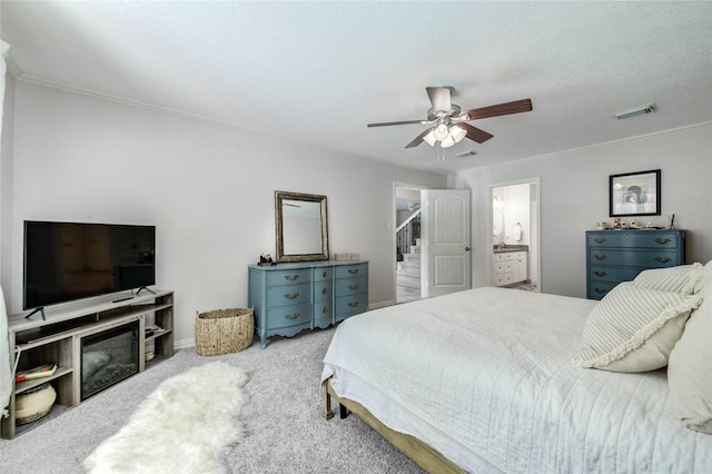 11715 Cypresswood Dr, Houston, TX 77070 - carpeted bedroom with ceiling fan and connected bathroom