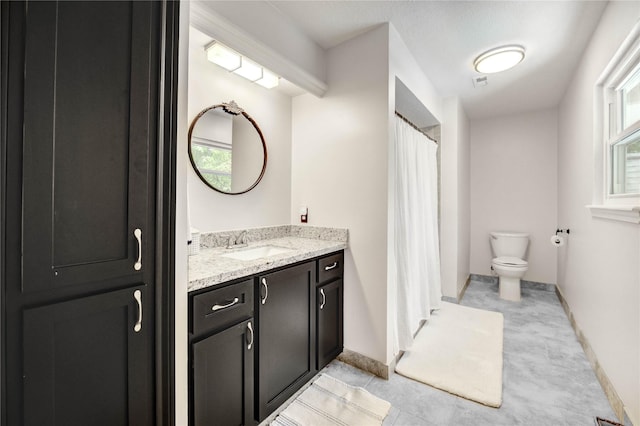 11715 Cypresswood Dr, Houston, TX 77070 - full bathroom featuring vanity, healthy amount of natural light, a shower with shower curtain, and tile patterned flooring