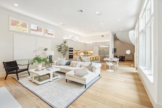 2013 Persa St, Houston, TX 77019 - living area featuring light wood-style flooring and recessed lighting
