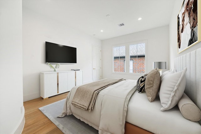 2013 Persa St, Houston, TX 77019 - bedroom with light wood-style floors and recessed lighting