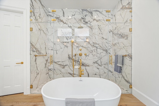 2013 Persa St, Houston, TX 77019 - full bathroom with a freestanding bath, a marble finish shower, and wood finished floors