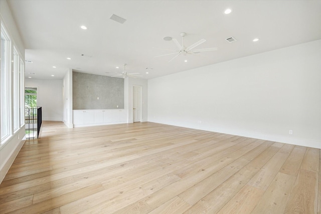 2013 Persa St, Houston, TX 77019 - spare room with light wood-style floors, recessed lighting, and a ceiling fan