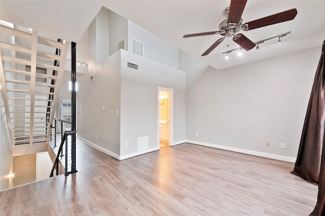 1616 Elgin St Unit 11, Houston, TX 77004 - unfurnished room featuring track lighting, a ceiling fan, wood finished floors, and high vaulted ceiling