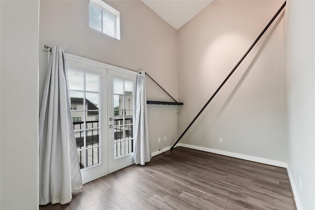 1616 Elgin St Unit 11, Houston, TX 77004 - spare room featuring french doors, wood finished floors, and high vaulted ceiling