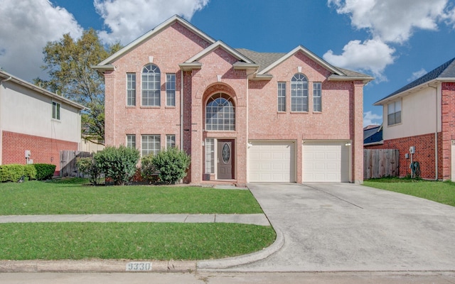 5330 Imperial Grove Dr, Houston, TX 77066 - traditional home with driveway, a garage, and brick siding