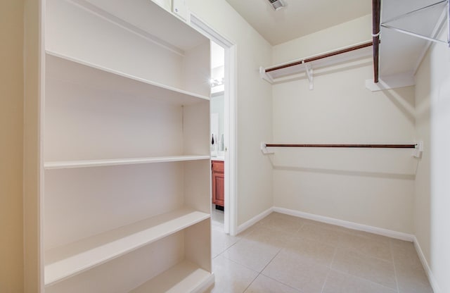 5330 Imperial Grove Dr, Houston, TX 77066 - walk in closet with light tile patterned floors