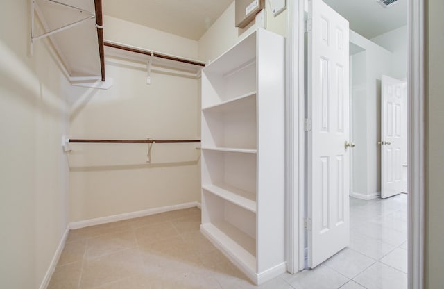 5330 Imperial Grove Dr, Houston, TX 77066 - walk in closet featuring light tile patterned flooring