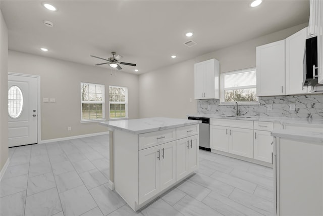 8004 Birmingham St A/B, Unit A/B Houston, TX 77028 - kitchen with stainless steel dishwasher, ceiling fan, a center island, tasteful backsplash, and recessed lighting