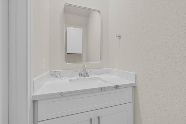 8004 Birmingham St A/B, Unit A/B Houston, TX 77028 - bathroom featuring a textured wall and vanity
