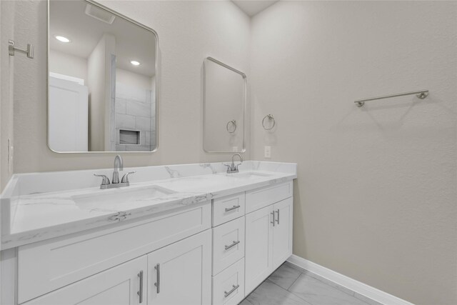 8004 Birmingham St A/B, Unit A/B Houston, TX 77028 - bathroom with marble finish floors, double vanity, and recessed lighting