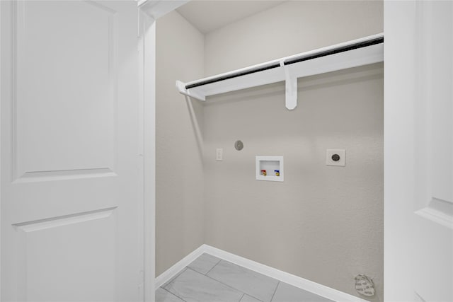 8004 Birmingham St A/B, Unit A/B Houston, TX 77028 - laundry area with gas dryer hookup, electric dryer hookup, hookup for a washing machine, and light marble finish flooring
