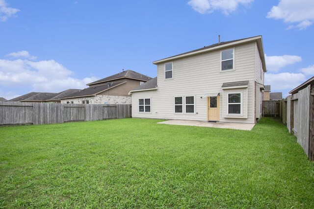 2311 Langley Dr, Rosharon, TX 77583 - back of property with a patio and a fenced backyard