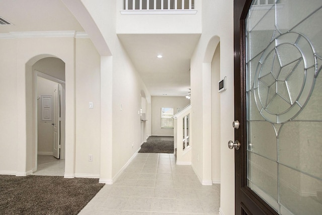 2311 Langley Dr, Rosharon, TX 77583 - entrance foyer with arched walkways, recessed lighting, light tile patterned flooring, and light carpet