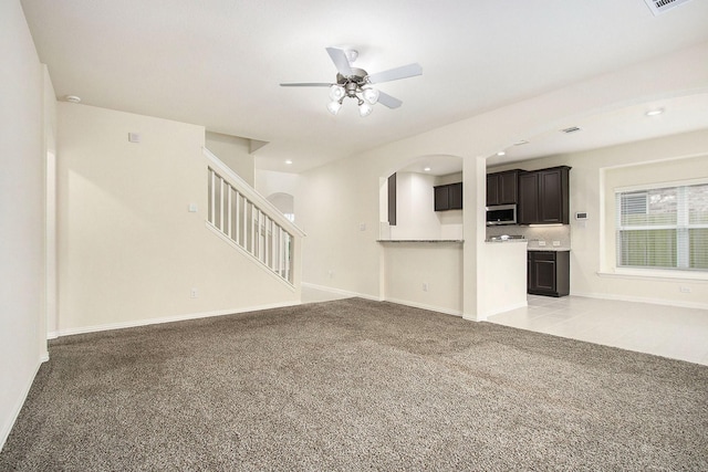 2311 Langley Dr, Rosharon, TX 77583 - unfurnished living room with light carpet, ceiling fan, stairs, and recessed lighting