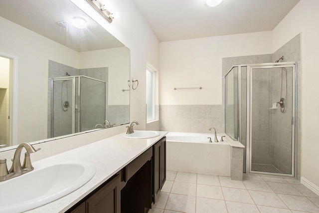 2311 Langley Dr, Rosharon, TX 77583 - full bathroom with a garden tub, a shower stall, tile patterned floors, and double vanity
