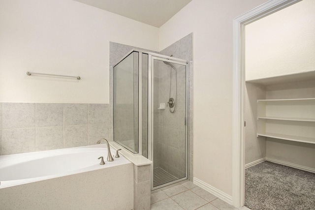 2311 Langley Dr, Rosharon, TX 77583 - bathroom with a stall shower, a garden tub, and tile patterned floors