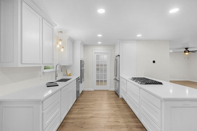 73 Fairway Dr, Normangee, TX 77871 - kitchen with stainless steel appliances, recessed lighting, light wood-type flooring, and light countertops