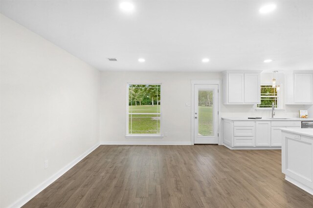 73 Fairway Dr, Normangee, TX 77871 - kitchen featuring light countertops, wood finished floors, white cabinetry, and recessed lighting