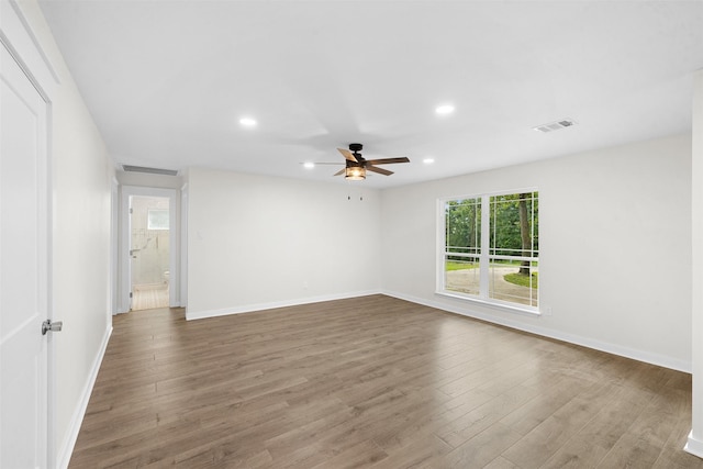 73 Fairway Dr, Normangee, TX 77871 - spare room featuring ceiling fan, wood finished floors, and recessed lighting