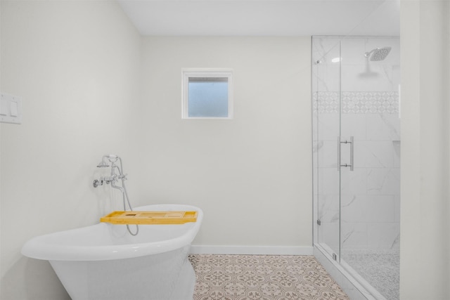73 Fairway Dr, Normangee, TX 77871 - full bathroom featuring a stall shower, a soaking tub, and tile patterned flooring