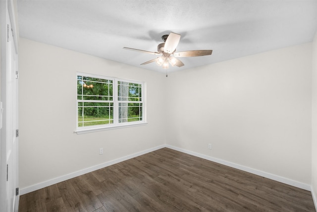 73 Fairway Dr, Normangee, TX 77871 - empty room with dark wood-style floors and ceiling fan