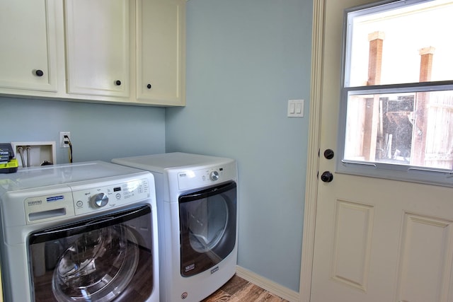 5926 Lattimer Dr, Houston, TX 77035 - washroom with cabinet space, separate washer and dryer, healthy amount of natural light, and wood finished floors