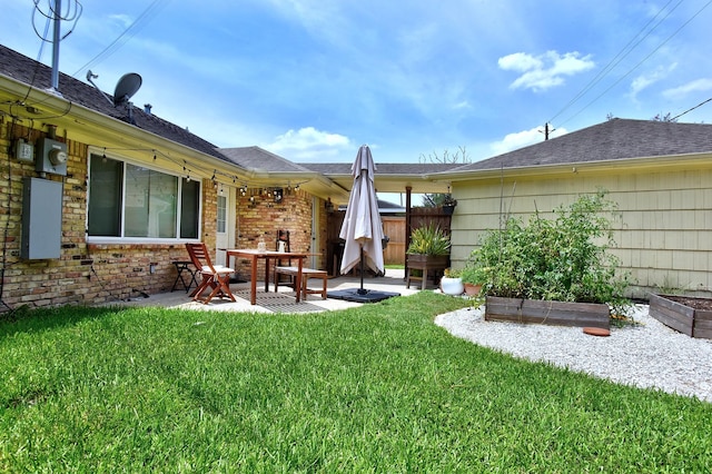 5926 Lattimer Dr, Houston, TX 77035 - view of yard featuring a patio and a garden