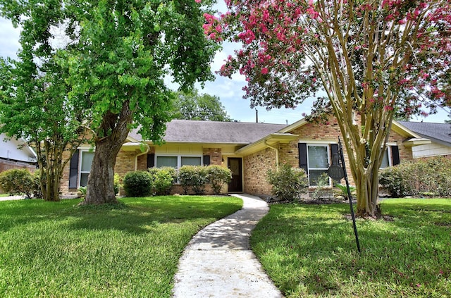 5926 Lattimer Dr, Houston, TX 77035 - ranch-style house featuring brick siding, a front yard, and roof with shingles