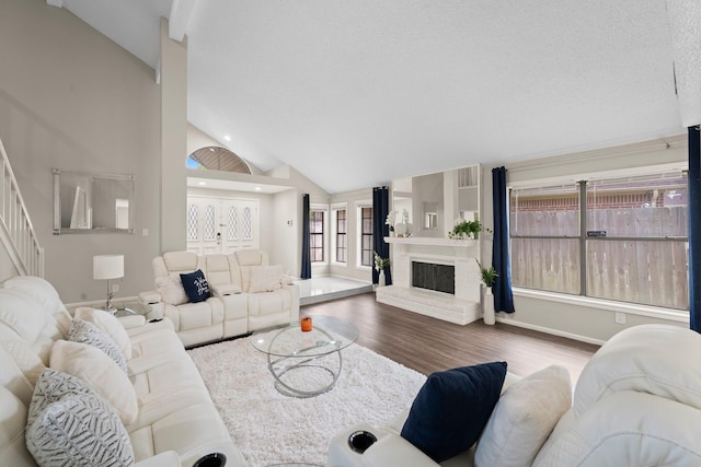 9827 Gold Cup Way, Houston, TX 77065 - living area with wood finished floors, a fireplace, stairway, recessed lighting, and high vaulted ceiling