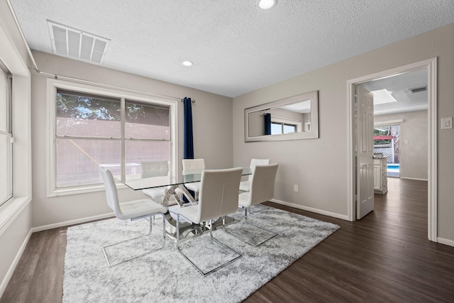 9827 Gold Cup Way, Houston, TX 77065 - dining space featuring a textured ceiling, dark wood-style floors, and recessed lighting