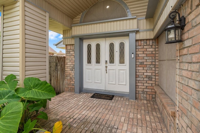 9827 Gold Cup Way, Houston, TX 77065 - doorway to property with brick siding