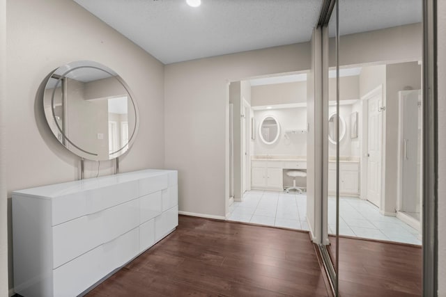 9827 Gold Cup Way, Houston, TX 77065 - hallway featuring wood finished floors