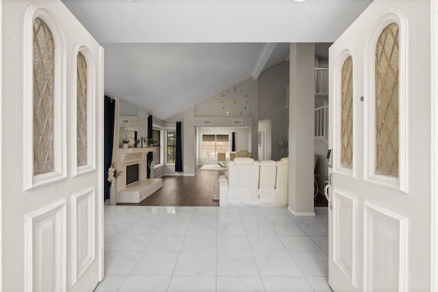 9827 Gold Cup Way, Houston, TX 77065 - entrance foyer featuring a fireplace and high vaulted ceiling