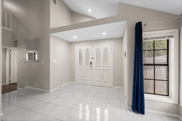 9827 Gold Cup Way, Houston, TX 77065 - foyer entrance featuring vaulted ceiling, light tile patterned floors, and recessed lighting