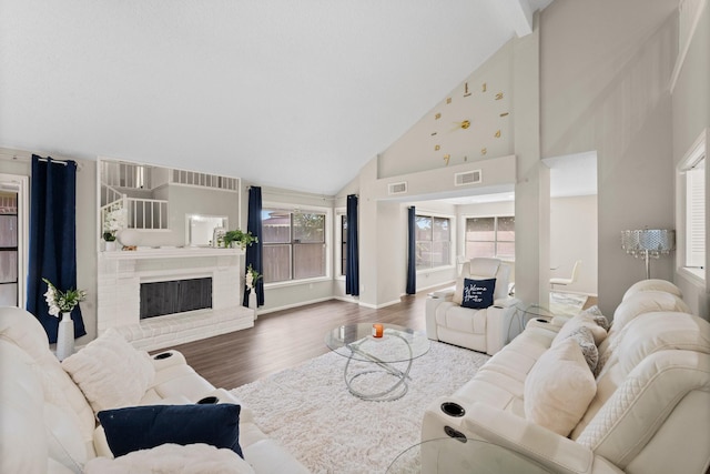 9827 Gold Cup Way, Houston, TX 77065 - living room with high vaulted ceiling, wood finished floors, plenty of natural light, and a brick fireplace